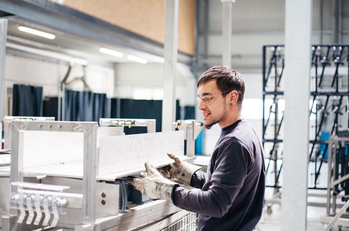 Certified employee at a machine